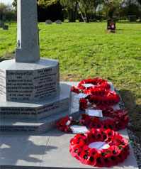 Poppy wreaths on war memorial